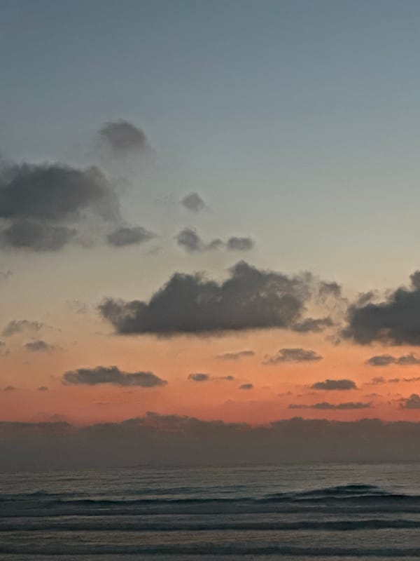 Haifa's Mediterranean waterfront at dusk, coast road to nightfall