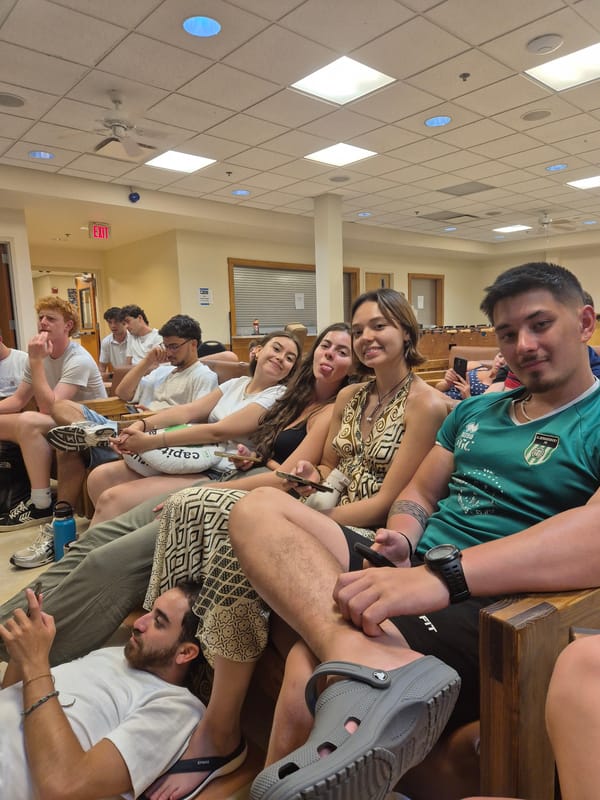 Young adults watch USA-Paraguay soccer match in Washington Township lounge