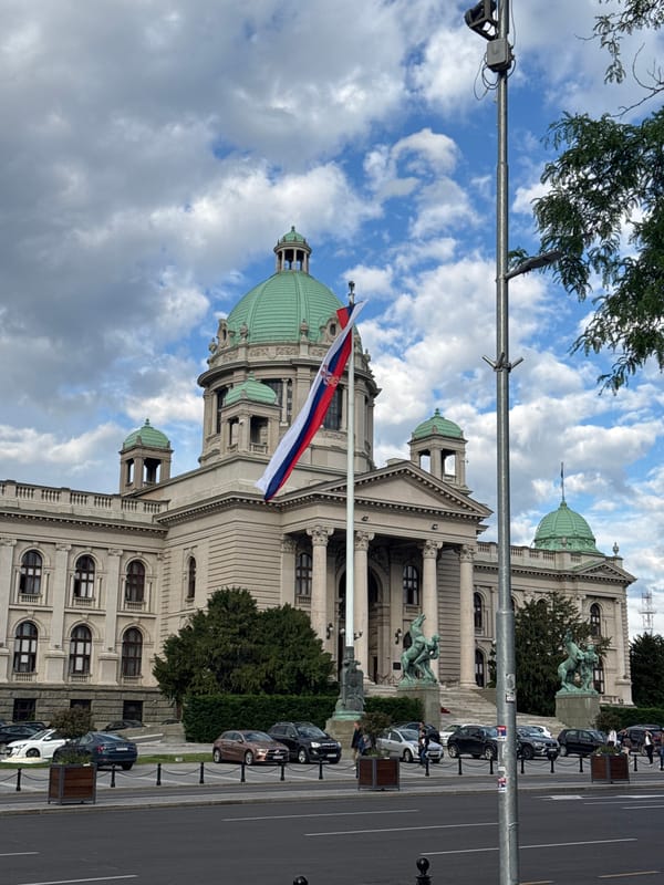 Tourist documents afternoon stroll through central Belgrade with drinks