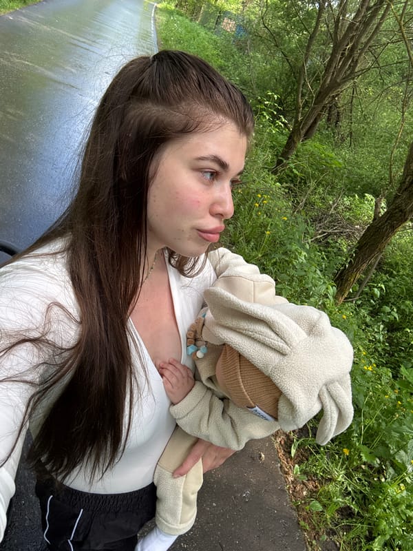 Mother and baby enjoy spring walk in Russian park