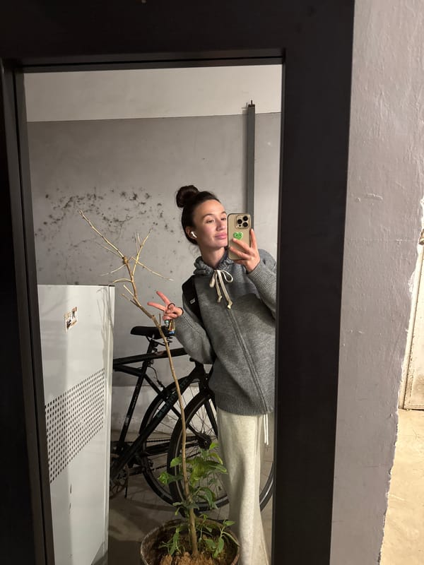 Tel Aviv scenes: woman's mirror selfie, building graffiti
