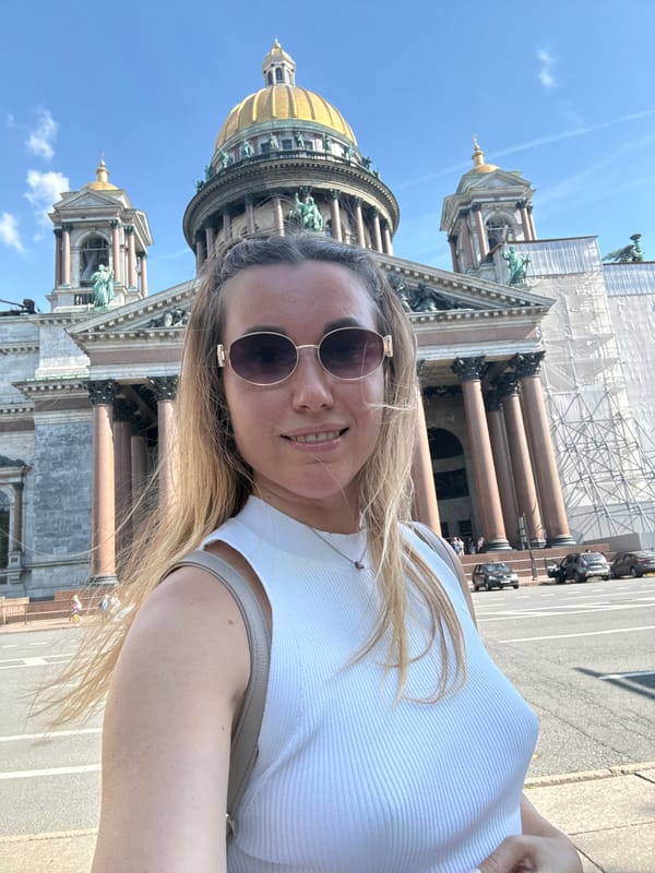 Tourist Takes Selfies at St. Isaac's Cathedral in Sunny Weather