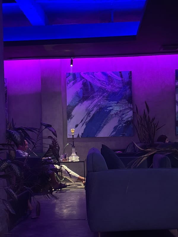 Hookah lounge interior documented in Indonesia with neon lighting