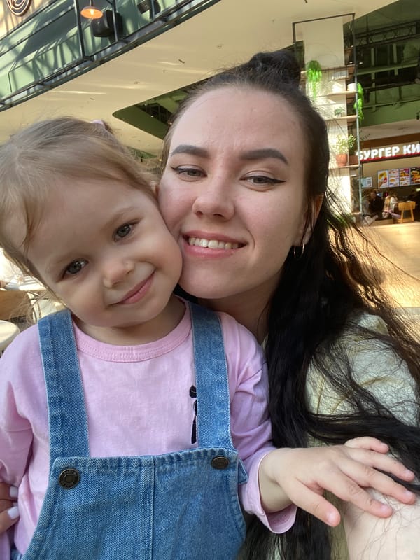 Mother, child enjoy afternoon shopping mall visit in Perm