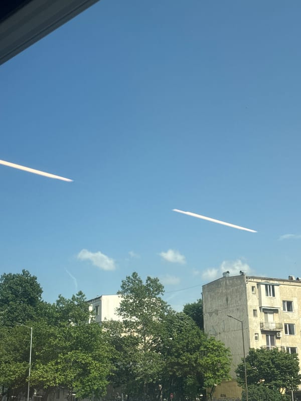 Aircraft contrails observed crossing clear blue sky