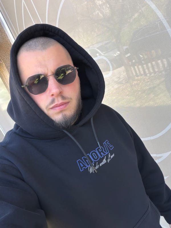 Man in AMORE hoodie observed at undisclosed location