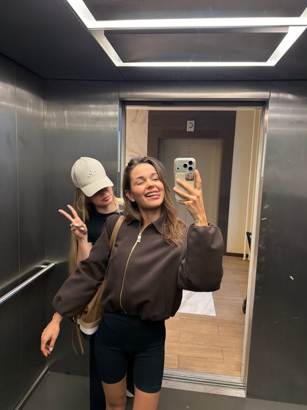 Mirror selfie in a Moscow elevator, June 2026
