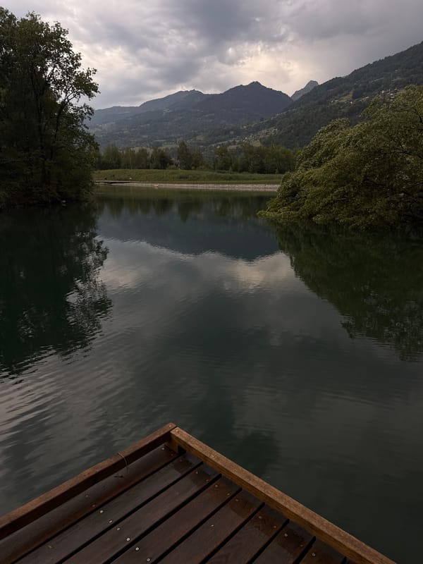 Calm mountain waterfront with dock near Sallanches, France