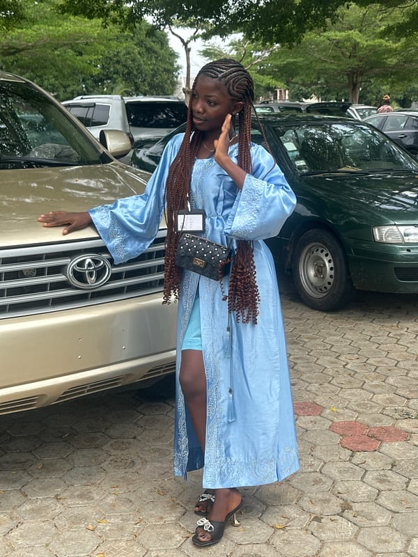 Community gathering in Itoga, Nigeria with formal ceremony vibes.