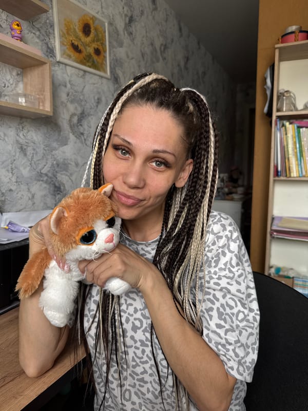 Woman photographed with plush cat in Rusanovo, Russia