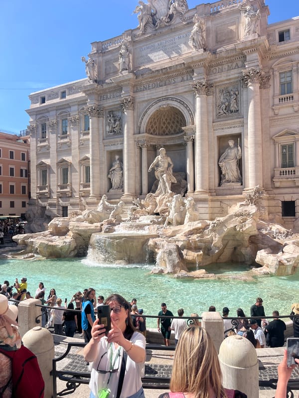 Tourists flock to Trevi Fountain on sunny Rome afternoon