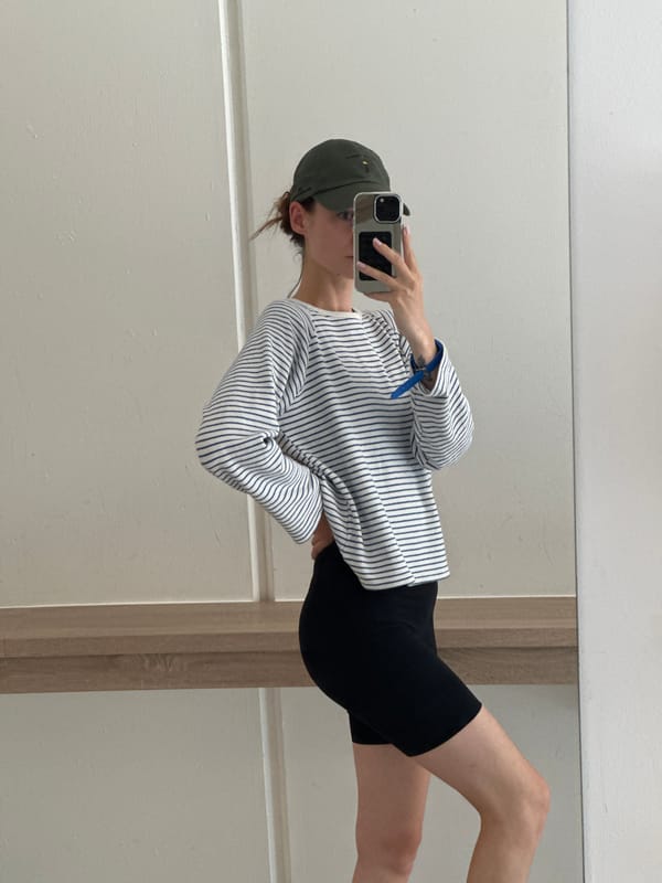 Woman takes selfies in building corridor in Kiel, Germany