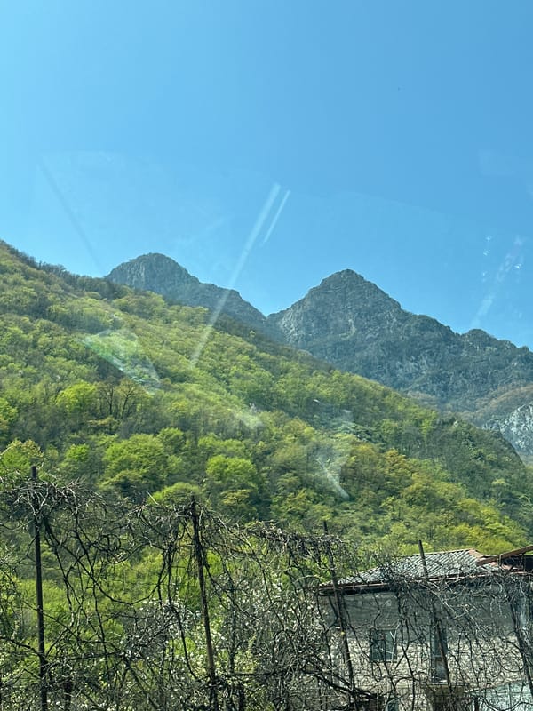 Morning mountain view photographed through window in Kapan, Armenia