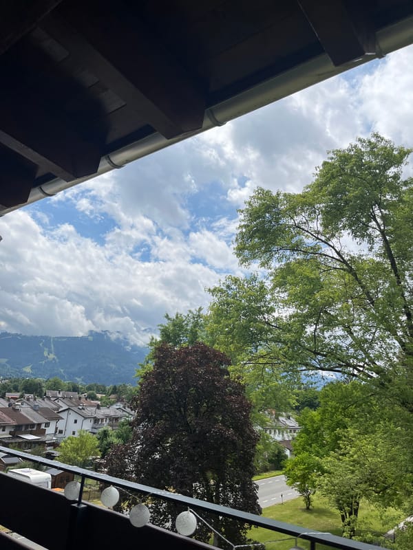 Morning views from a Garmisch-Partenkirchen balcony, Alps in the clouds