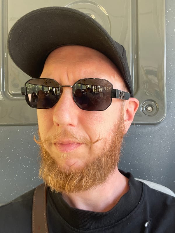 Close-up portrait with black cap and reflective sunglasses, St. Petersburg