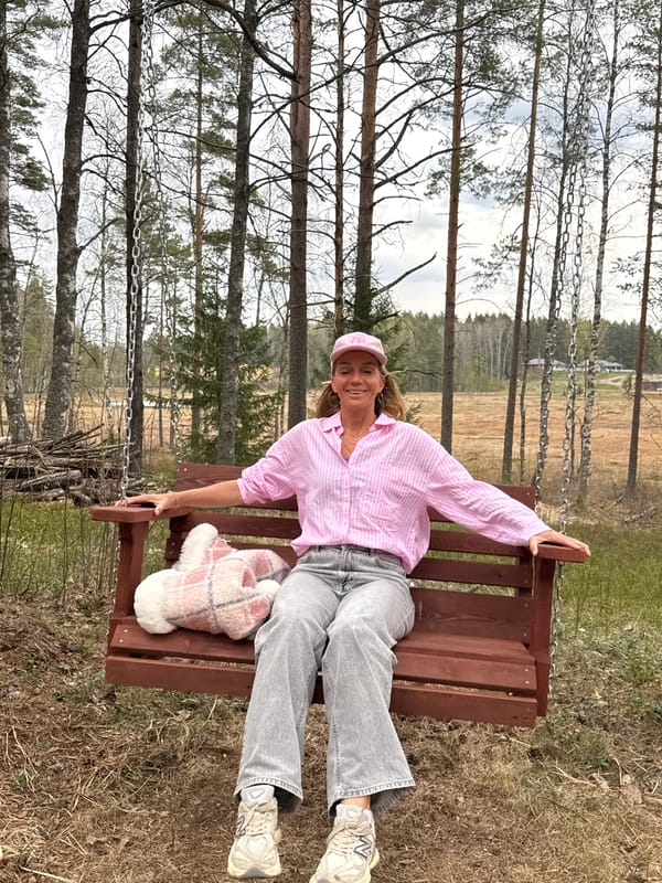 Woman enjoys forest swing near Steklyannyi, Russia