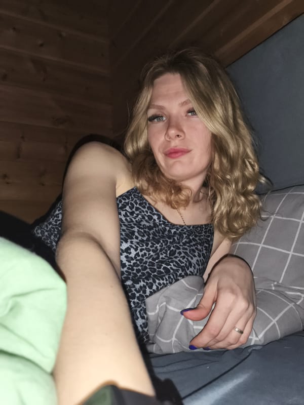 Woman resting in bed observed in Русский Вожой