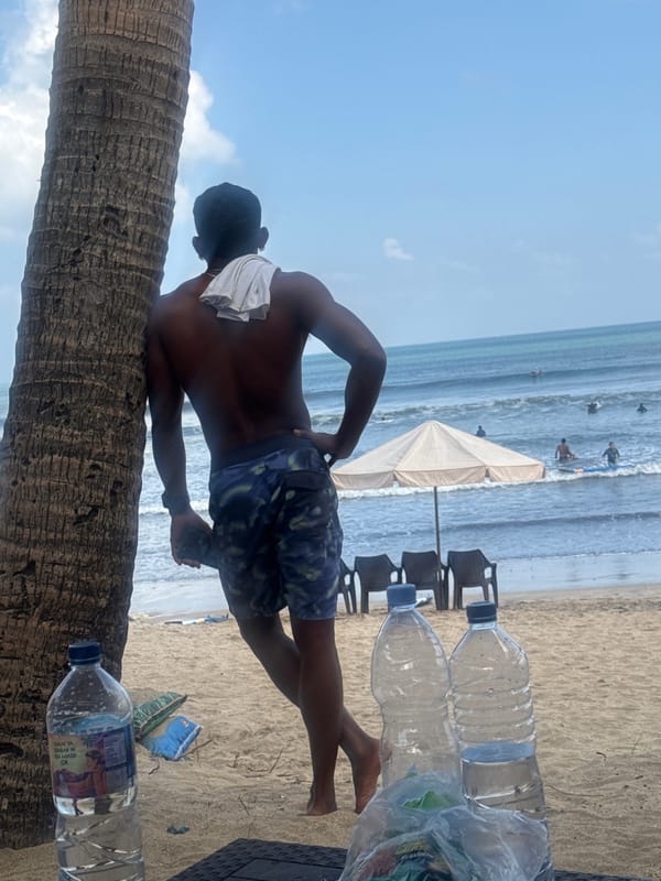 Kuta Beach in full swing: surfers, strollers, and shoreline life