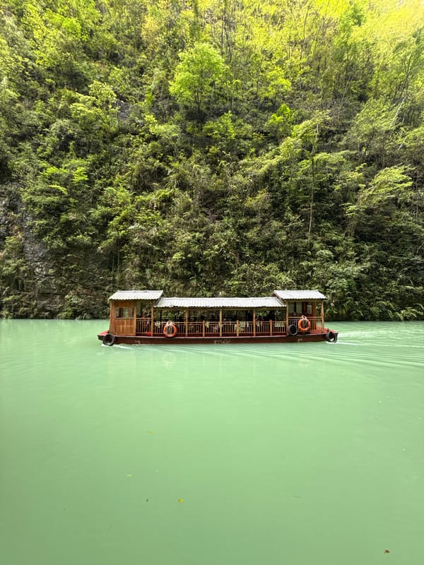 Tourist boat tours scenic Baofeng Lake Waterfall in Zhangjiajie