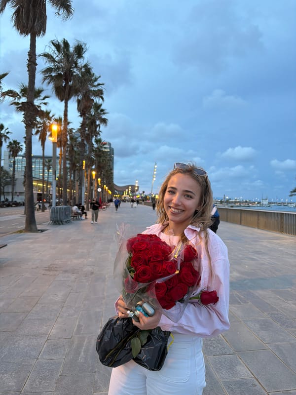 Woman poses with red roses in Barcelona