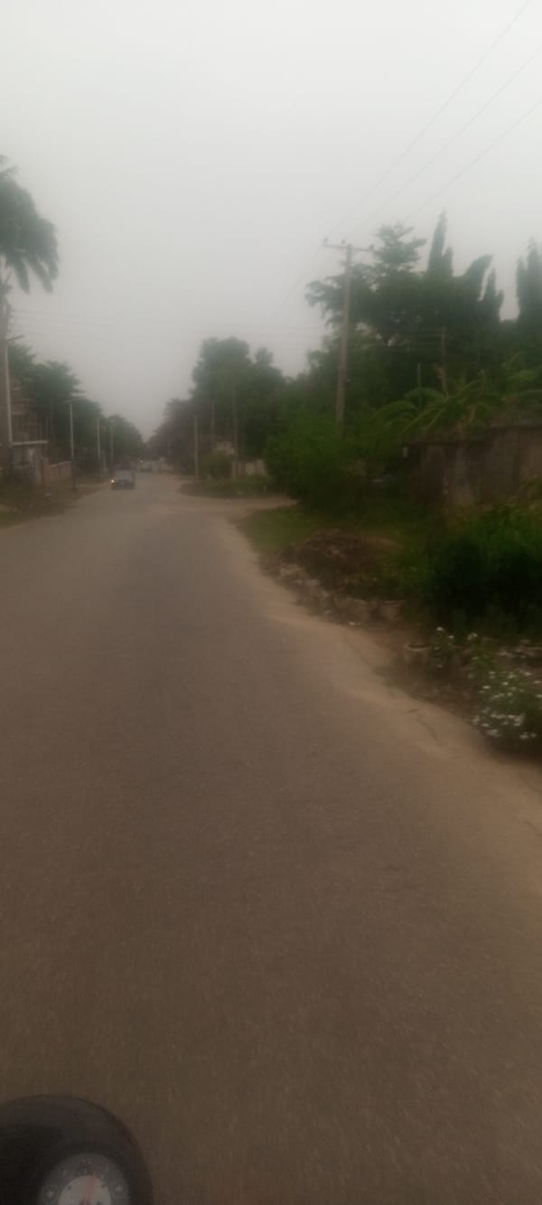 Hazy conditions reduce visibility on Unguwar Rimi street