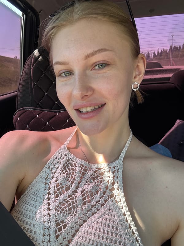 Woman smiles in car interior, Perm Russia
