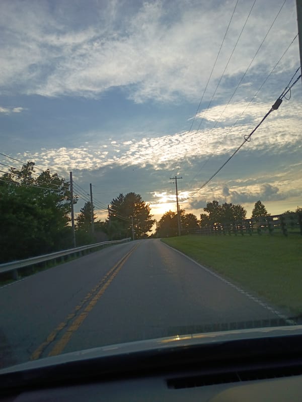 Evening drive through rural Kentucky, fields and open road