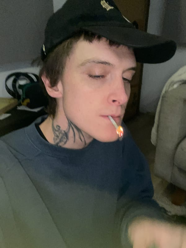 Man smoking marijuana indoors in La Lucila, Argentina