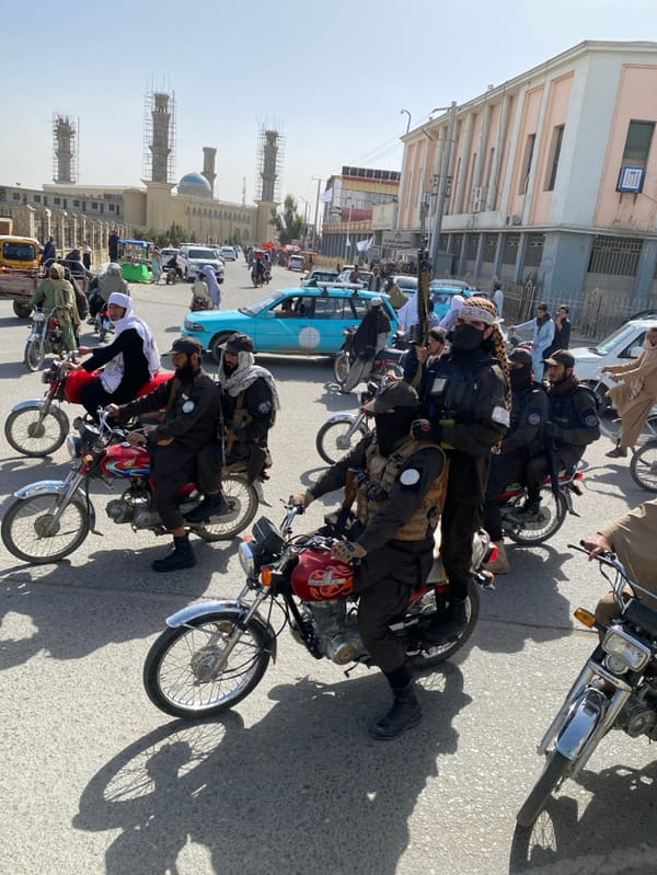 Armed Security Forces Patrol Commercial Streets in Kandahar