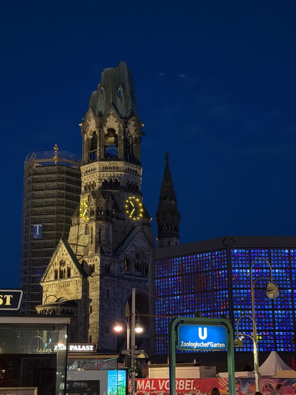 Berlin at night: memorial church ruins meet glowing modern towers