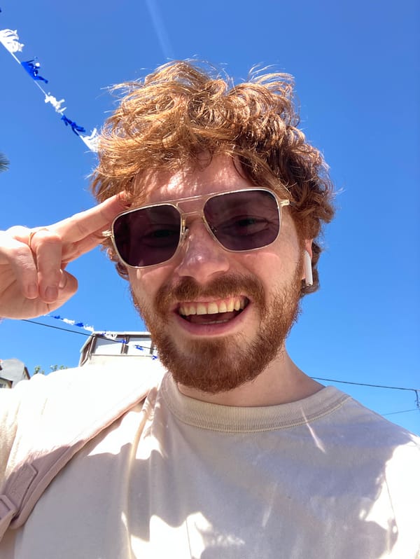Red-haired man takes cheerful selfie in Bat Yam