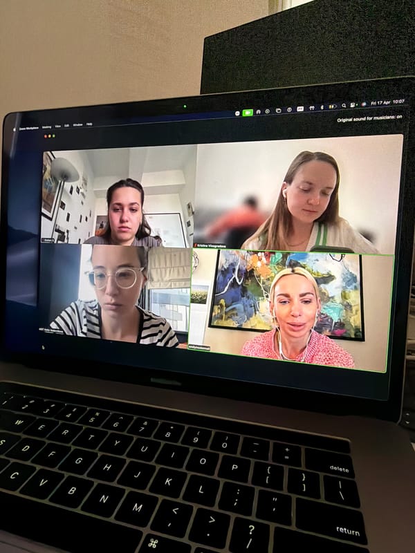 Video conference session observed on angled laptop in Como