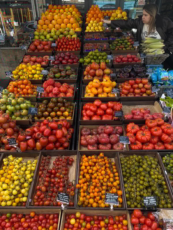 London market vendor displays variety of fresh produce