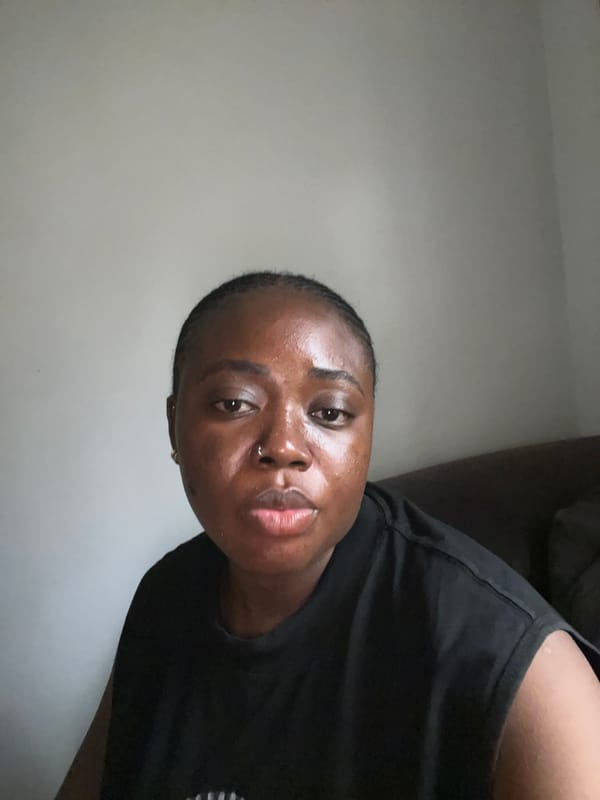 Young woman photographed across Abuja during rainy afternoon