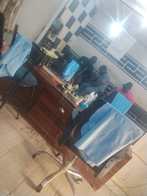 Daily life unfolds across Jos, Nigeria barbershops and streets