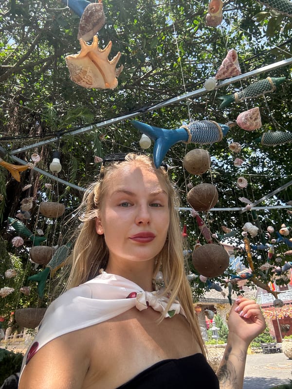 Selfies and stone dragons at a Vietnamese temple garden