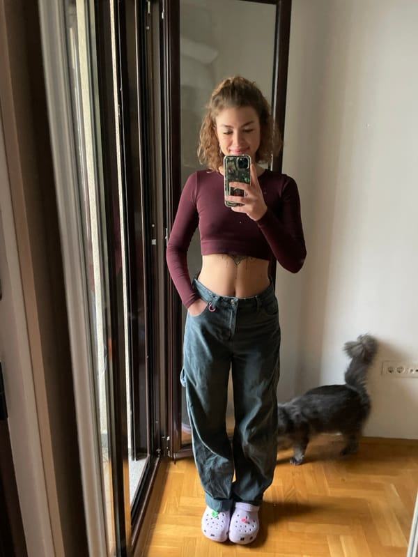 Woman takes mirror selfies with cat in Boreti, Montenegro