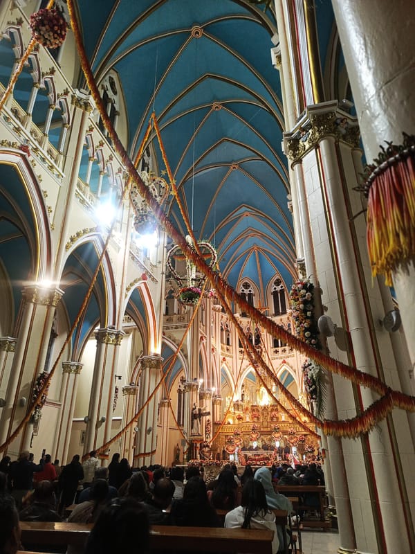 Church service documented with blue vaulted ceilings, gold accents