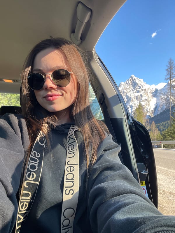 Woman documents Dolomites road trip with selfies in Italy