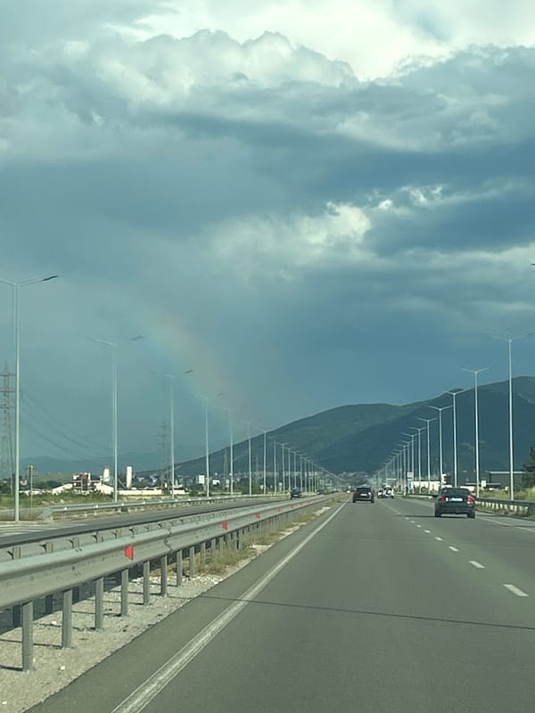 Highway drive past mountains captured in vehicle dashcam sequence