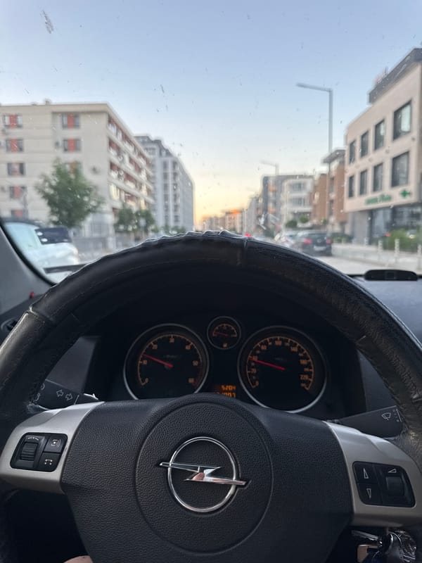 Driver navigates Sofia streets at low speed during evening commute
