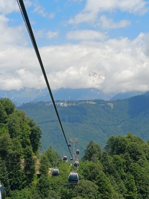 Summer cable car views over forested mountains in Estosadok, Russia