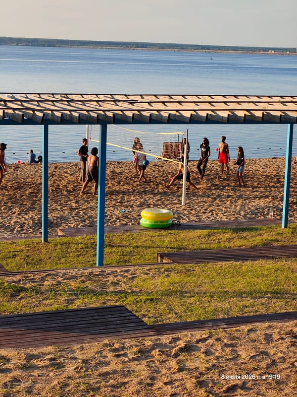 Afternoon at a waterfront promenade: walking, cycling, beach views