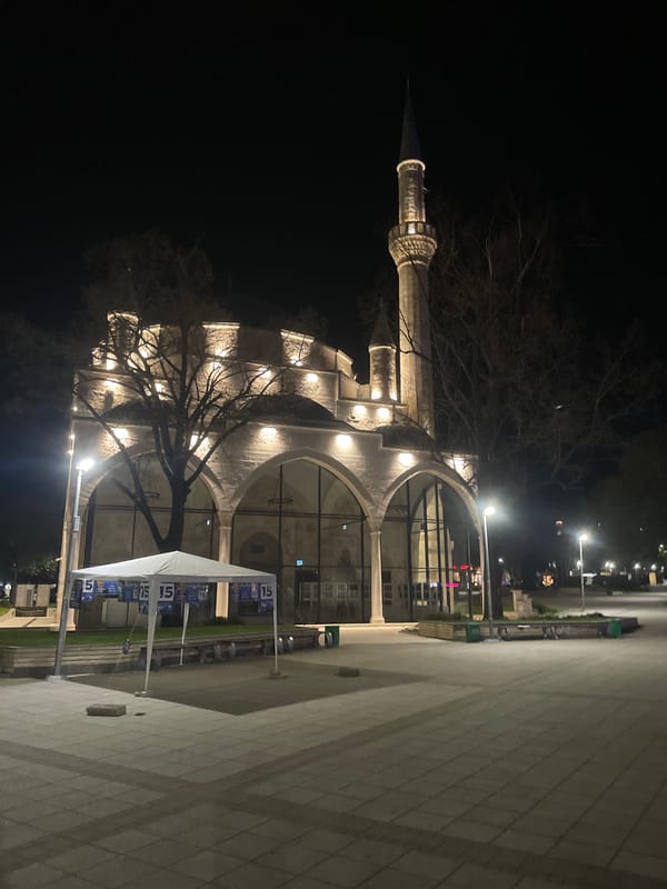 Night photography session captures illuminated Razgrad landmarks and parked vehicle