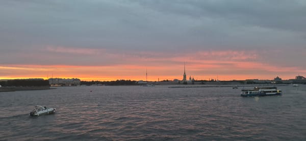Saint Petersburg waterfront at dusk, Neva River under a summer sunset