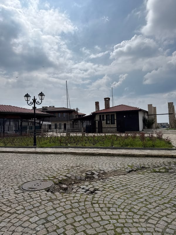 Tourist captures traditional architecture during morning walk in Nesebar
