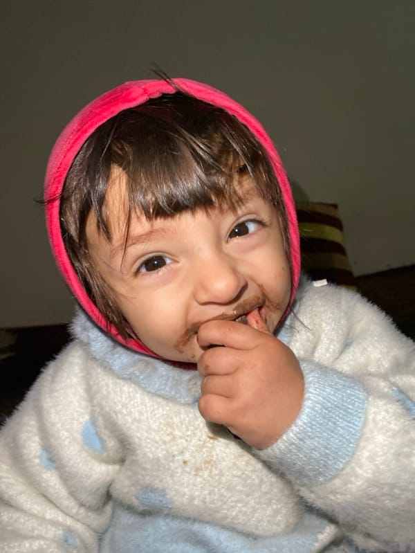 Father-daughter chocolate challenge documented in Kandahar home