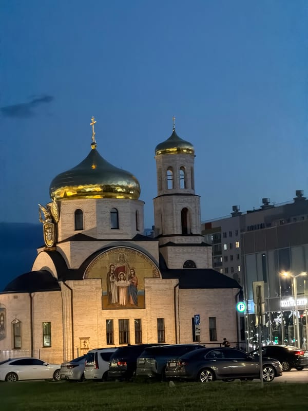 Nizhnekamsk's Orthodox church at dusk, golden domes and all