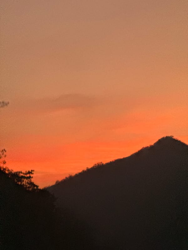 Orange hazy sky observed over Cortada de Maturín landscape