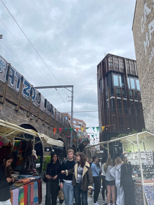 London market visitor documents street scenes and cupcake moment